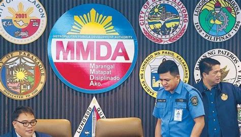 mmda uniform|MMDA to pursue raps vs driver who had enforcer cling to car hood.